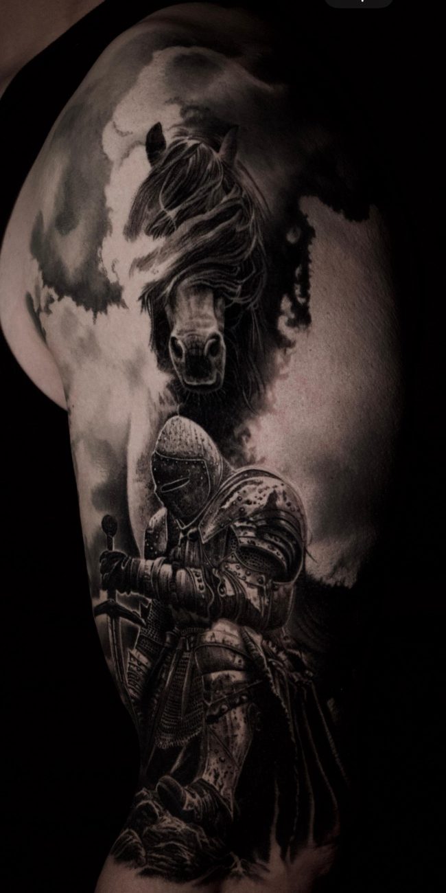 a tattoo of a knight and horse